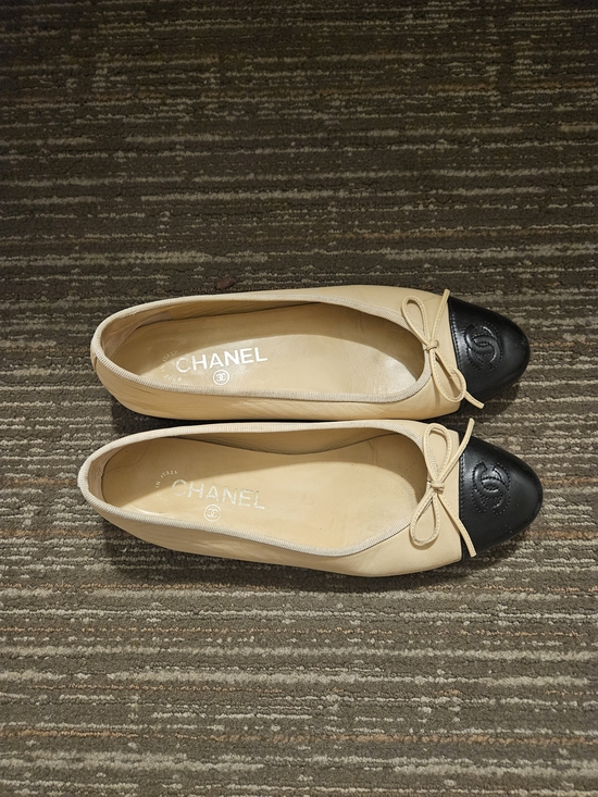 CHANEL Shoes - CHANEL Beige Leather Ballet Flats with Black Cap Toe and Bow 38.5 Like New